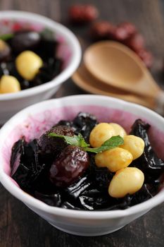 Local Thai dessert glass jelly isolated in wood background