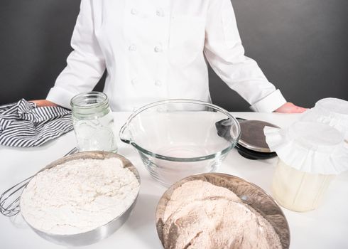 Ingredients to bake cinnamon rolls on a white countertop.