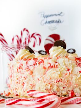 Traditional Christmas White Chocolate Peppermint Cheesecake on white background.