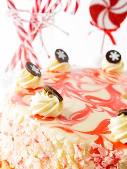 Traditional Christmas White Chocolate Peppermint Cheesecake on white background.