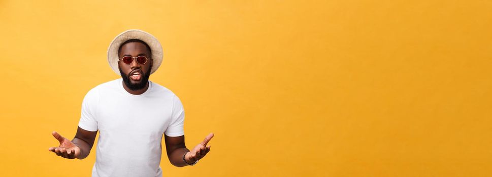 Young african american man wearing white t-shirt shouting and screaming loud to side with hand on mouth. Communication concept