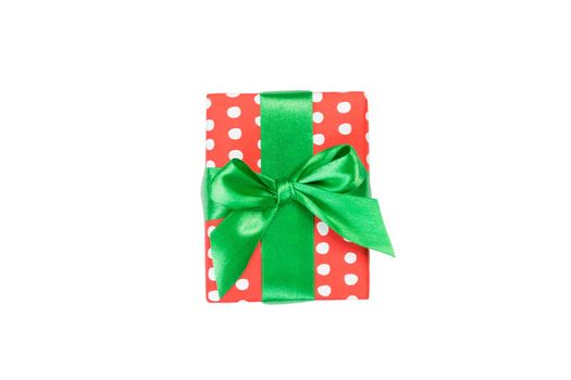Christmas or other holiday handmade present in red paper with Green ribbon. Isolated on white background, top view. thanksgiving Gift box concept.