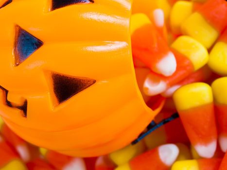 Candy corn candies falling out of Halloween treat bag.