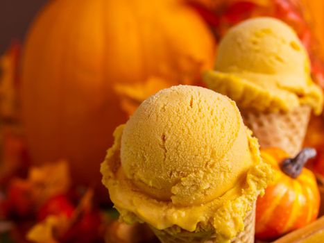 Scoop of gourmet pumpkin gelato in waffle cones.