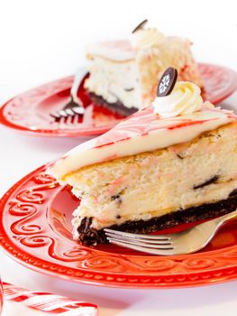 Traditional Christmas White Chocolate Peppermint Cheesecake on white background.