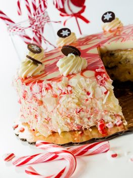 Traditional Christmas White Chocolate Peppermint Cheesecake on white background.