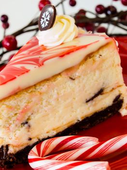 Traditional Christmas White Chocolate Peppermint Cheesecake on white background.