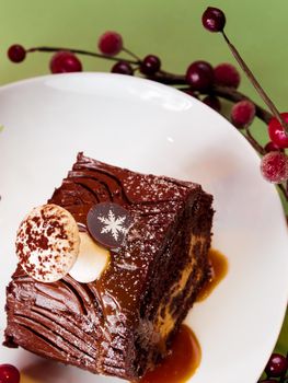 Traditional Christmas Yule Log cake decorated with marzipan mushrooms.