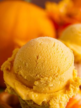 Scoop of gourmet pumpkin gelato in waffle cones.