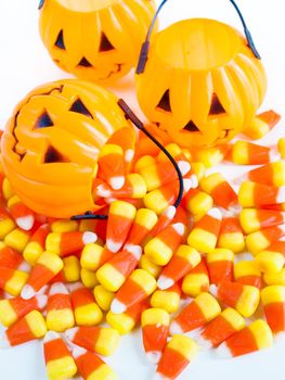 Candy corn candies falling out of Halloween treat bag.