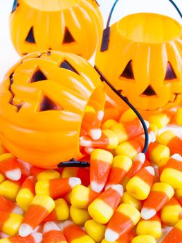 Candy corn candies falling out of Halloween treat bag.