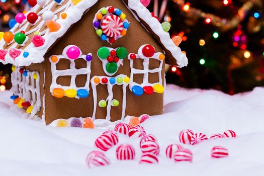Gingerbread house with round peppermint candies.