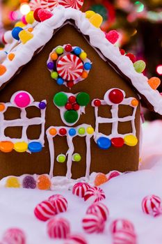 Gingerbread house with round peppermint candies.