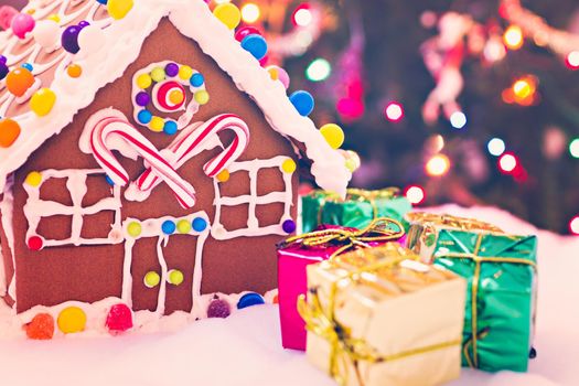 Gingerbread house with small presents.