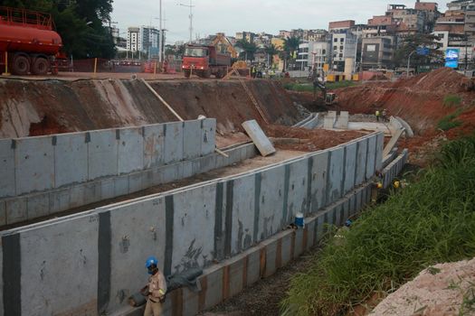 salvador, bahia, brazil - july 29, 2022: construction of sewage pipeline exclusive way for BRT transport system in the Lucaia canal region in the city of Salvador.
