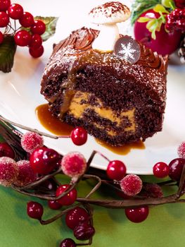 Traditional Christmas Yule Log cake decorated with marzipan mushrooms.