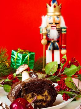 Traditional Christmas Yule Log cake decorated with marzipan mushrooms.