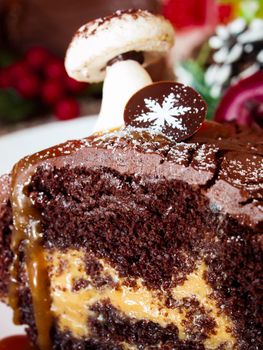 Traditional Christmas Yule Log cake decorated with marzipan mushrooms.