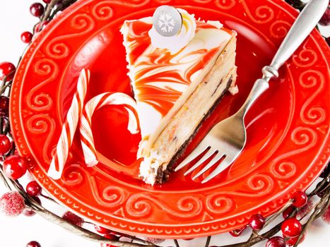 Traditional Christmas White Chocolate Peppermint Cheesecake on white background.