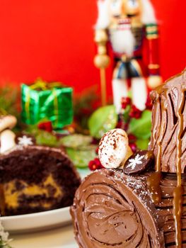 Traditional Christmas Yule Log cake decorated with marzipan mushrooms.