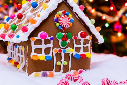 Gingerbread house with round peppermint candies.