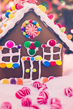 Gingerbread house with round peppermint candies.