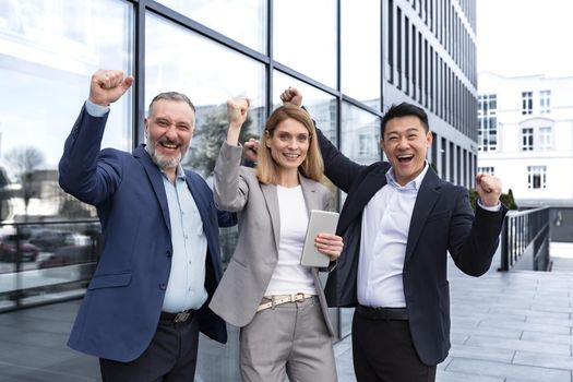 Success Happy Group business people excited rejoicing looking at camera after successful completion project, and smiling Portrait diverse team employees celebrating victory.