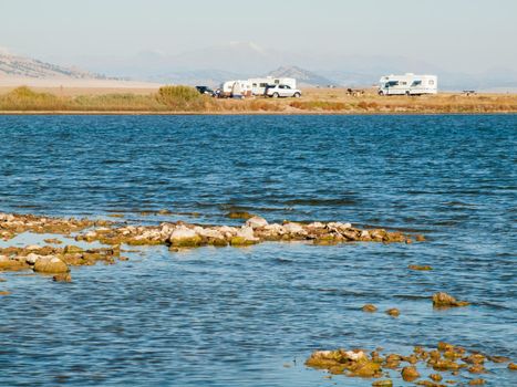 Motorhome campsite near the lake on early morning late in the season.