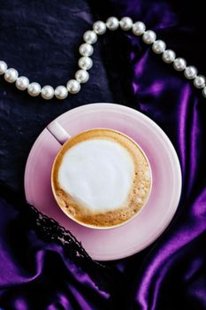 Menu, branding and recipe concept - Cup of cappuccino for breakfast with satin and pearls jewellery background, organic coffee with lactose free milk in parisian cafe for luxury vintage holiday brand