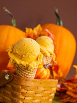 Scoop of gourmet pumpkin gelato in waffle cones.