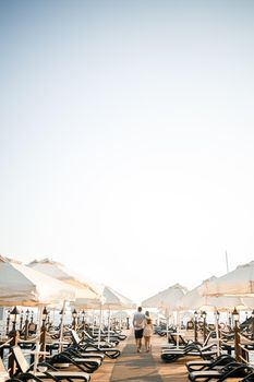 A loving couple is resting at the sea in Turkey. Man and woman on the pier. Sea tour. Honeymoon. Couple on a honeymoon trip. A beautiful couple travels the world. Happy couple on vacation.