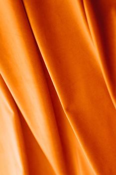 Decoration, branding and surface concept - Abstract orange fabric background, velvet textile material for blinds or curtains, fashion texture and home decor backdrop for luxury interior design brand