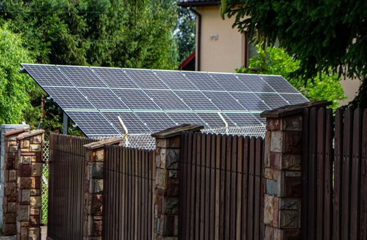 Historic farm house with modern solar panels on roof and wall High quality photo