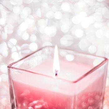 Festive decoration, branding and aromatherapy spa concept - Rose aromatic candle on Christmas and New Years glitter background, Valentines Day luxury home decor and holiday season brand design