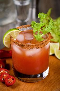 Michelada the Mexican Bloody Mary. Made with tequila, spicy sauce, served over ice in a glass of celery with a peppery rim, garnished with a stalk of celery and a wedge of lime. Drinks and cocktails with hot sauce, add some spice to your life