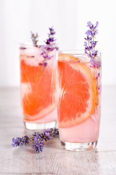 A cocktail of grapefruit and lavender paired with tequila, full of bright citrus aromas and fragrant herbs, showcasing the best fruits of the season.