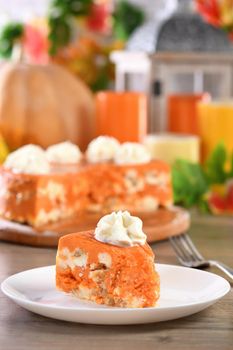 Slice of Pumpkin and cottage cheese casserole on a plate. This is a delicious dessert filled with autumnal notes. It is full of pumpkin spice aromas, creamy softness with raisins.