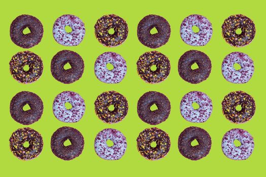 Top view to the donuts over green background