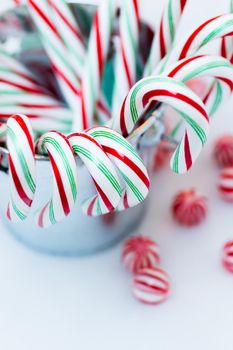 Peppermint candy canes on white background.