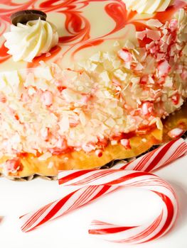 Traditional Christmas White Chocolate Peppermint Cheesecake on white background.