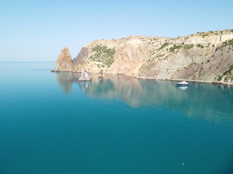 Aerial panoramic view of beautiful sunset above sea. Beautiful seascape. Sun glare, small waves on the water surface. Evening. Horizon. Nobody. No people. Copy space. Never-ending beauty of nature