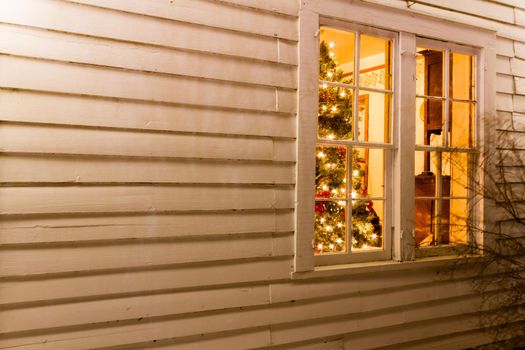 Historic farm decorated with Christmas lights.