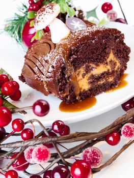 Traditional Christmas Yule Log cake decorated with marzipan mushrooms.