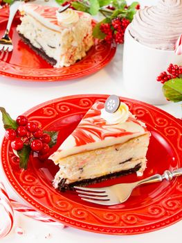 Traditional Christmas White Chocolate Peppermint Cheesecake on white background.
