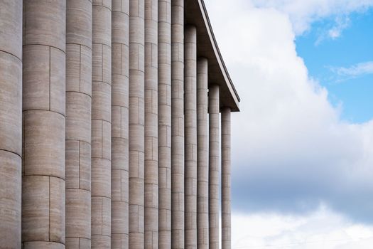 Saint-Petersburg, Russia. - August 22, 2021. Fragment of the facade of a modern building with architectural columns. Selective focus.