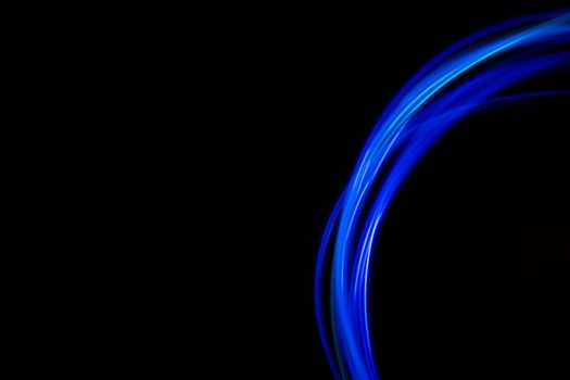 Abstract modern banner design. Glowing neon lines on black background. High quality photo