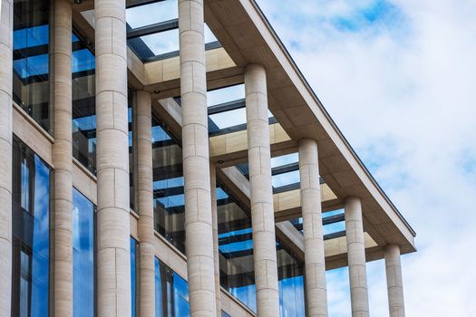 Saint-Petersburg, Russia. - August 22, 2021. Fragment of the facade of a modern building with architectural columns. Selective focus.