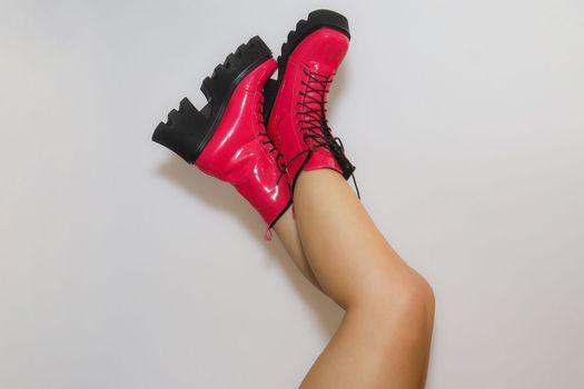 Studio portrait legs fashion boots pink. High quality photo