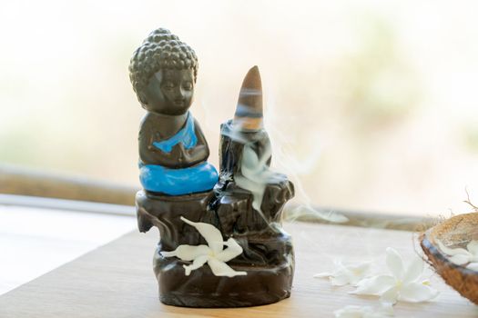 Buddha and incense, meditation and aromatherapy. High quality photo