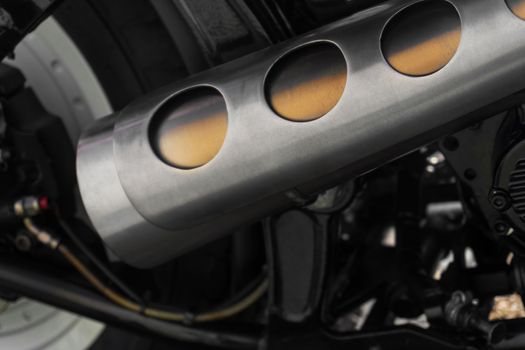 Custom motorcycle part, metal exhaust pipe close up (powder coating)